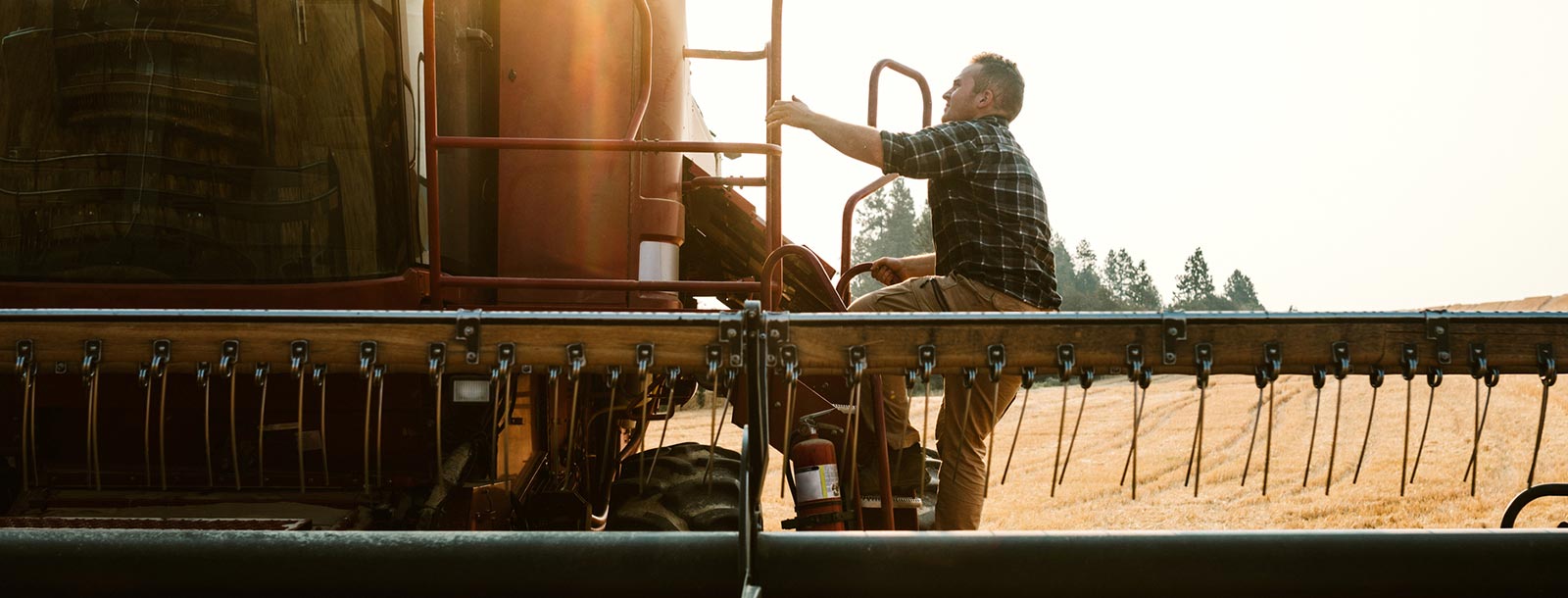 Man climbing in combine.